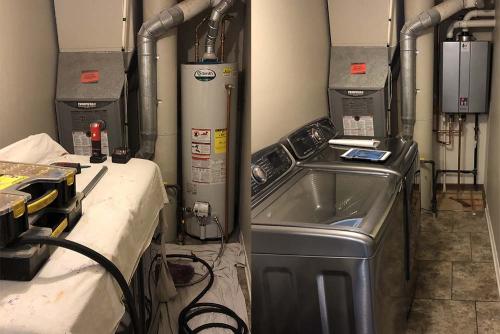 tankless-water-heater-in-laundry-room-before-and-after